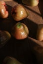 Close up Rose apple or jambu on dark background under sunlight. Royalty Free Stock Photo