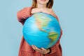 Rotation of the planet Earth. Girl holding a globe