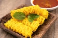 Roti Jala or Net Bread and curry dipping sauce Royalty Free Stock Photo