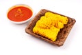 Roti Jala or Net Bread and curry sauce on white background Royalty Free Stock Photo