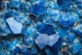 Close-up of rough blue stone texture, rugged, uneven surface with speckles of darker hues. Royalty Free Stock Photo