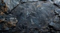 Close-up of rough, dark grey stone texture with natural pattern. Perfect for background, design, and texture overlays Royalty Free Stock Photo