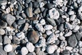 Close up of rounded beach stones and pebble stones.