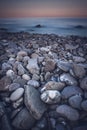 Rock seaside shore with black round stone on the island Royalty Free Stock Photo