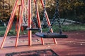 Close up of a row of emplty swings Royalty Free Stock Photo