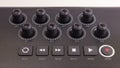 Close-up of a row of knobs on a MIDI Keyboard