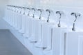 Close up row of outdoor urinals men public toilet. Royalty Free Stock Photo