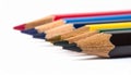 Close Up of Row of Sharpened Colored Pencils on White Background Royalty Free Stock Photo
