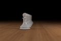 White, glass, chess pawns lined up on wood Royalty Free Stock Photo