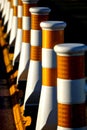 Close-up of a row of white traffic safety lane dividers