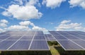 Close up rows array of polycrystalline silicon solar cells or photovoltaics in solar power plant turn up skyward absorb the sunlig