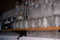 Close up of Rows of clean empty wine, beer , water glasses in loft restaurant natural light