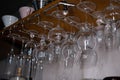 Close up of Rows of clean empty wine, beer , water glasses in loft restaurant natural light