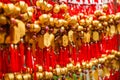 Close up rows Devotees hanging golden prayer bells for blessing at at Wong Tai Sin Temple, Hong Kong Royalty Free Stock Photo