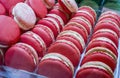 Close-up of rows of red strawberry-flavored macaroons