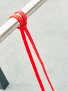 Close-up of a rubber elastic band training knot hanging on a workout crossbar