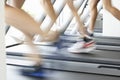 Close Up Of 3 Runners Feet On Running Machine In Gym Royalty Free Stock Photo