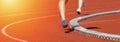 Close up of runners feet on the track field. Sunny day Royalty Free Stock Photo