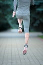 Close up of runners in training. Sport shoes on road. Rear view Royalty Free Stock Photo