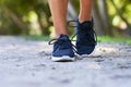 Close up of running shoes in park, woman running fitness outdoors Royalty Free Stock Photo