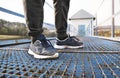 Close up of running sneakers dirty after run in spring nature. Royalty Free Stock Photo