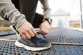 Close up of running sneakers dirty after run in spring nature. Tying shoelaces. Royalty Free Stock Photo