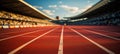 Close-up of a running track in a stadium with white striped markings.