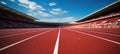 Close-up of a running track in a stadium with white striped markings.