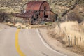 Close up of a rusted barn on an Idaho farm with winding road