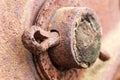 Close up of rusted cotter pin on abandoned farm equipment