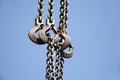 Close up of rusted hanging chain and blue sky Royalty Free Stock Photo