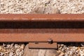 Close-up of rusted railway tie and bolt.