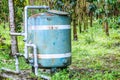 A close up of a rusted valve connects to water supply with metal pipe,Industrial metal water tab,seen in a garden Royalty Free Stock Photo