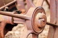 Close up of rusted wheel on abandoned farm equipment