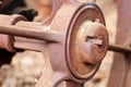 Close up of rusted wheel on abandoned farm equipment