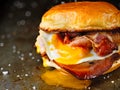 Rustic bacon egg breakfast sandwich bun Royalty Free Stock Photo