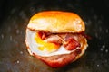 Rustic bacon egg breakfast sandwich bun Royalty Free Stock Photo
