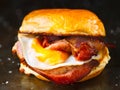 Rustic bacon egg breakfast sandwich bun Royalty Free Stock Photo