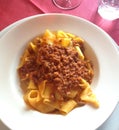 Close up of rustic italian pappardelle bolognese pasta in meat sauce Royalty Free Stock Photo