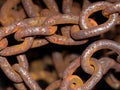 rusty anchor chains in a harbor Royalty Free Stock Photo