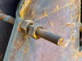 Close-up of a rusty bolt and nut on aged metal equipment Royalty Free Stock Photo