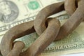 Rusty chain on dollar money - Banking and finance concept