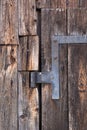 Old door hinge at wooden barn Royalty Free Stock Photo