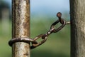 Close-up of rusty gate latch on a farm gate