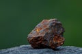 Close-up of a Rusty Iron Ore on a Smooth Surface