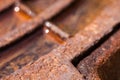Close up of the rusty metal manhole cover with water Royalty Free Stock Photo