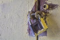 Close up of rusty old key lock on the painted white wall Royalty Free Stock Photo