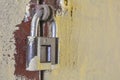 Close up of rusty old key lock on the painted white wall Royalty Free Stock Photo