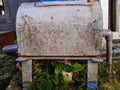 Close up rusty water meter cover metal box. Royalty Free Stock Photo