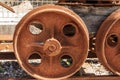 Rusty wheels of an ancient mining cart on the rails